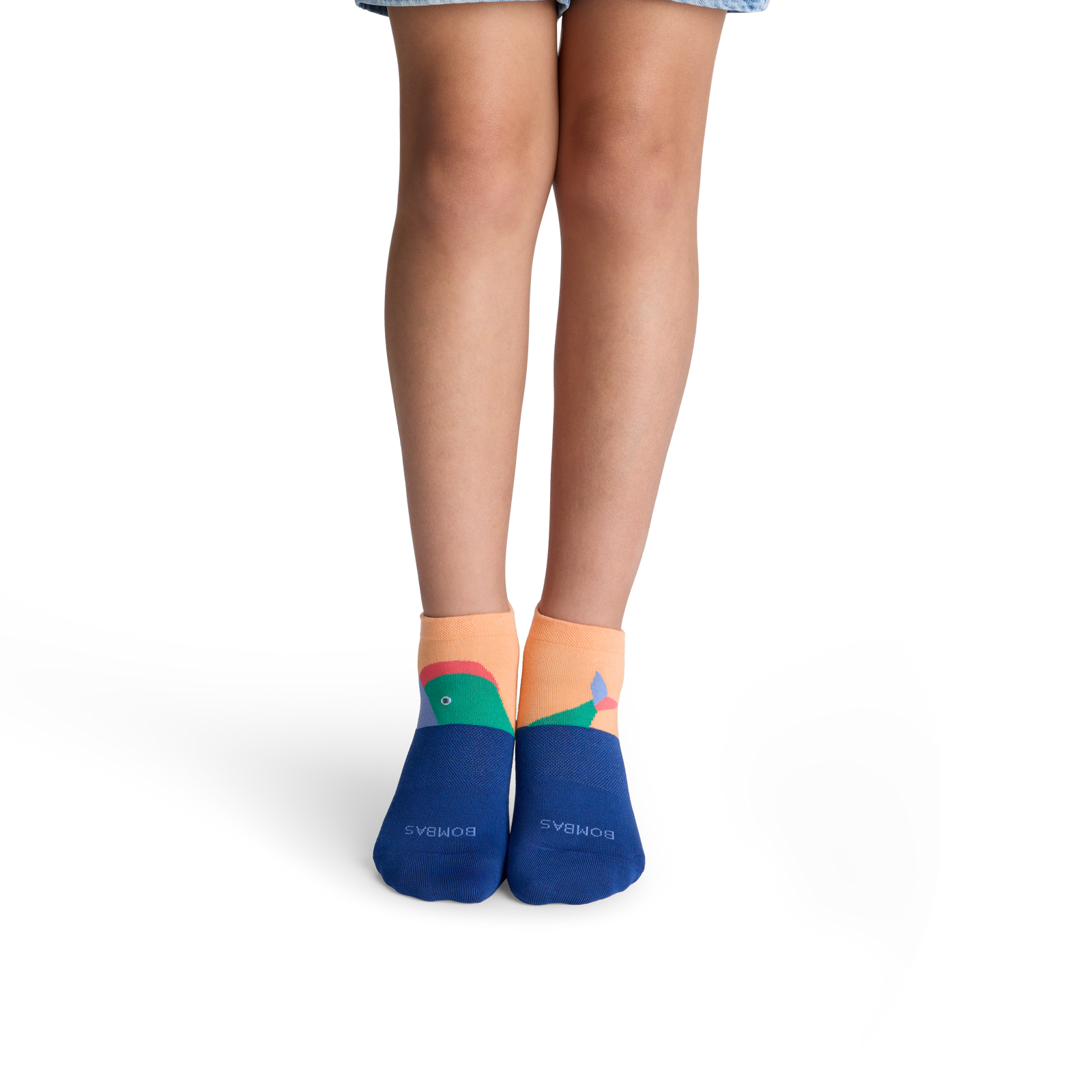 official-bombas::10409-apricot-youth-unisex-onmodel-2-transparent.png